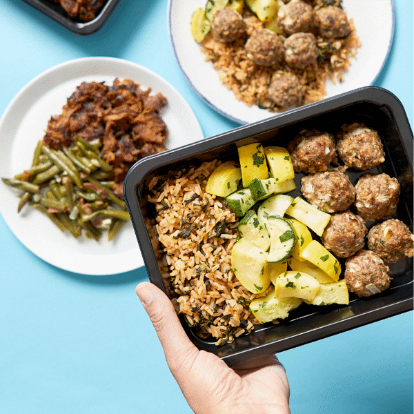 Gluten-Free Mediterranean Turkey Meatballs featuring feta, Greek-style rice, and vibrant roasted vegetables—a nutritious lunch ready to eat