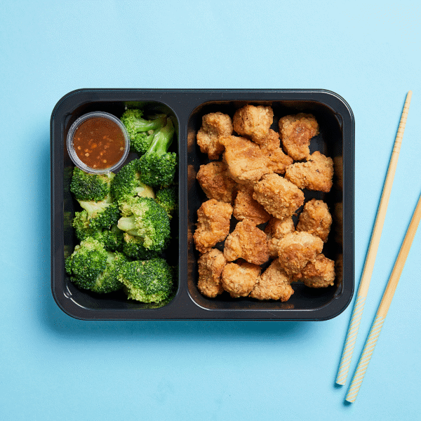 Orange Chicken & Broccoli features air-fried "popcorn" chicken coated in sauce and a side of broccoli in a food-safe container