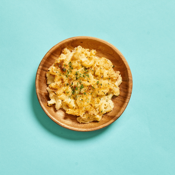 A nutritious mac n cheese, featuring a golden-brown, crispy top layer and dried cilantro which is a healthy meal prep for lunch