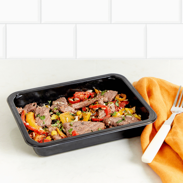 Marinated steak, roasted bell peppers, and black beans atop cilantro lime rice for gluten-free, dairy-free and low-carb meal prep