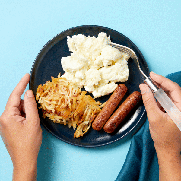 Take a bite of Egg White Trifecta, a keto-friendly breakfast serving scrambled egg whites, chicken apple sausage, and house-made hashbrowns.
