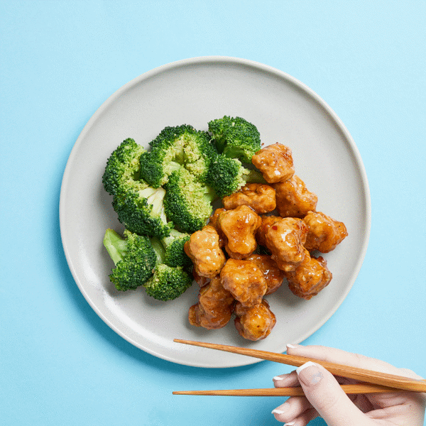 Orange Chicken & Broccoli features air-fried "popcorn" chicken, generously coated in a house-made orange-ginger sauce sweetened with honey.