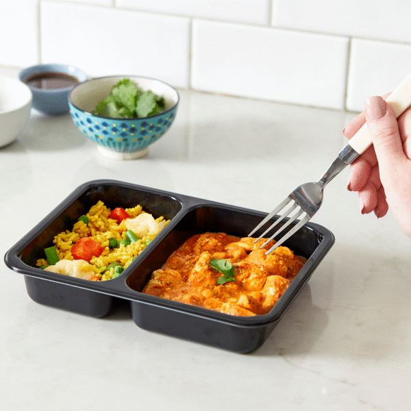 Gluten-free meal prep featuring  Dairy-Free Chicken Tikka Masala consisting of chicken, rice, and veggies served in an eco-friendly box