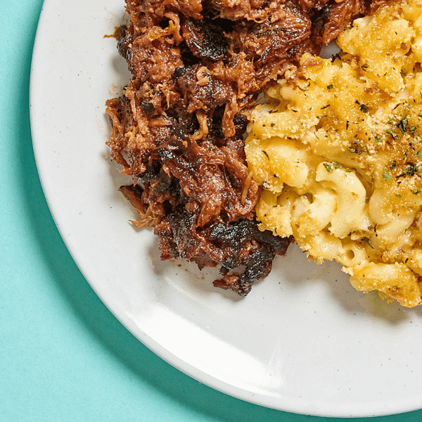 A close-up of a freshly prepared, healthy low on carbs meal – Fitlife Foods' signature BBQ beef with butternut and cheddar mac 'n cheese