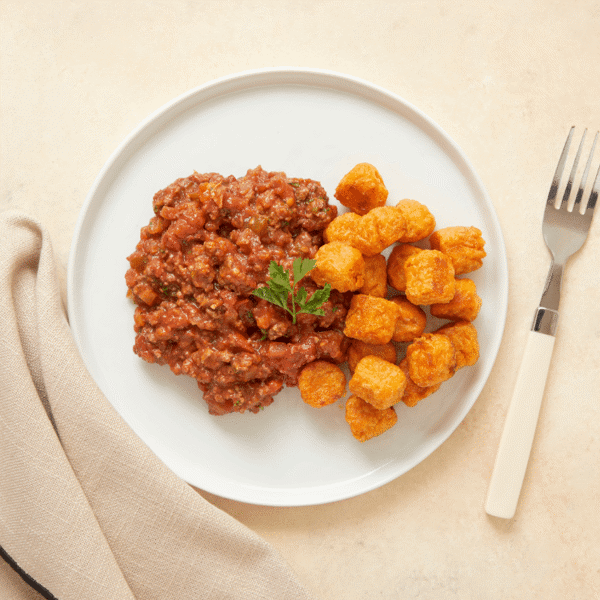Gluten-Free Sloppy Joe, lean ground beef is made with a fresh tomato sauce and a touch of honey, accompanied by savory sweet potato tots