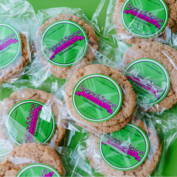 Packaged golden-brown Snickerdoodle cookies with cinnamon sugar and spice, benefiting all Children's Hospitals made by Fitlife Foods
