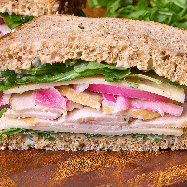 Close up of Herb Roasted Turkey and Provolone on Sprouted Multigrain